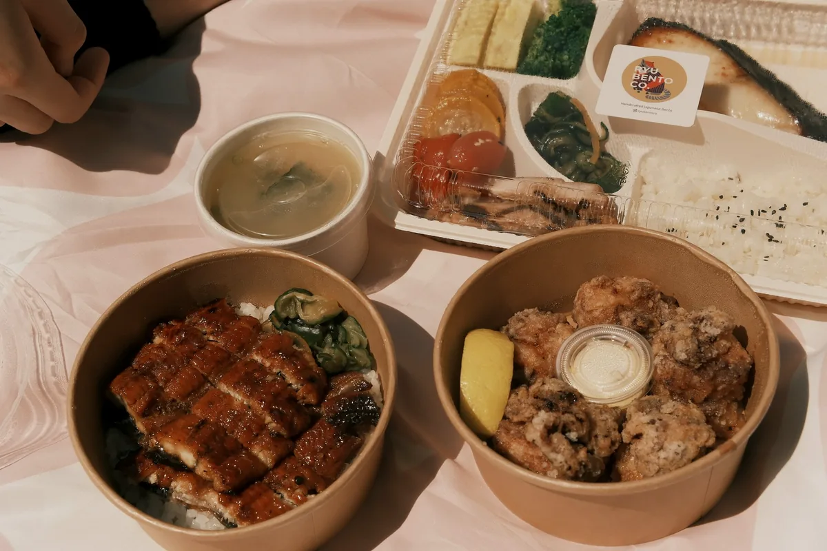 A Japanese set meal on a tray with rice, soup and side dishes