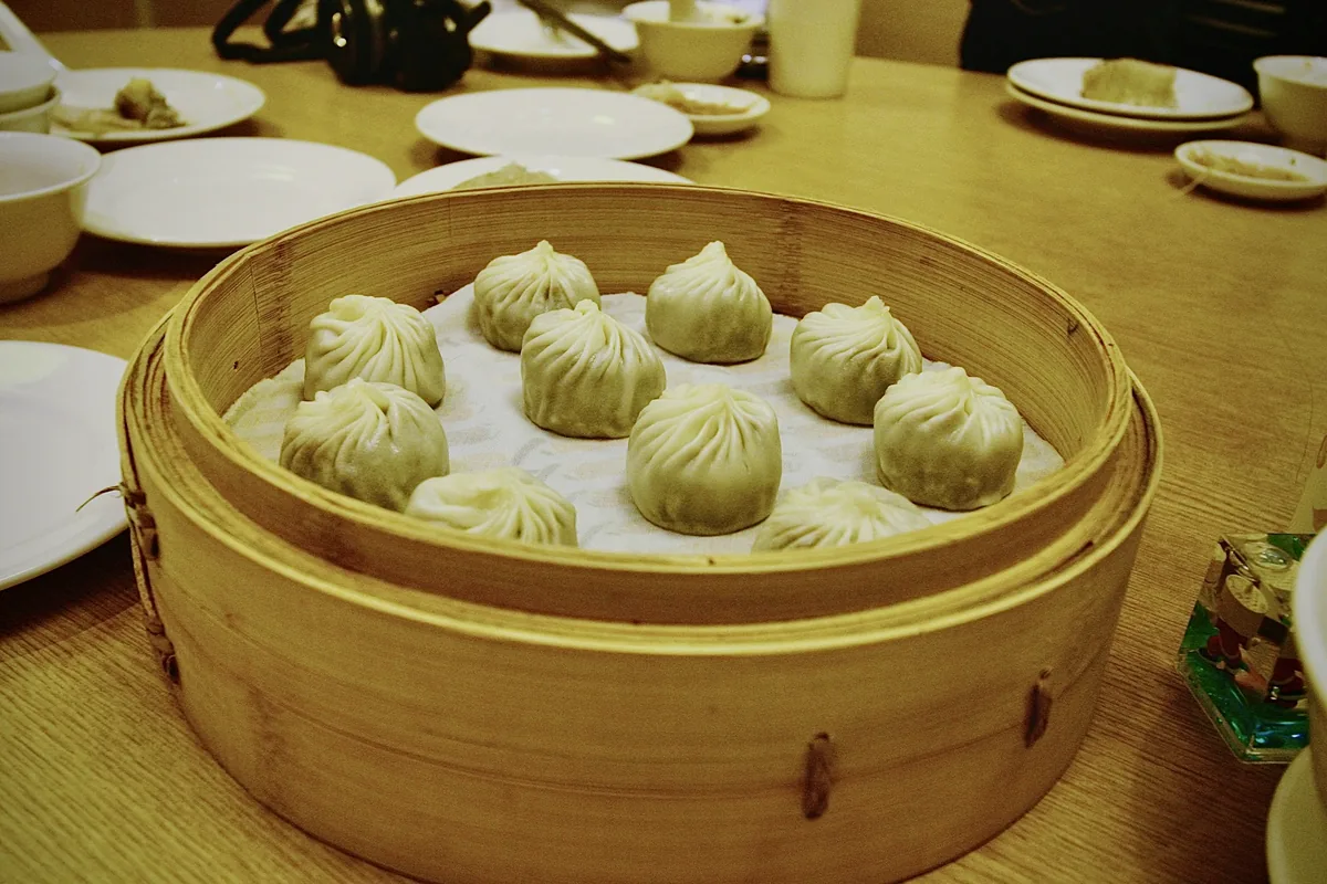 Dumplings in a stacked bamboo steamer basket