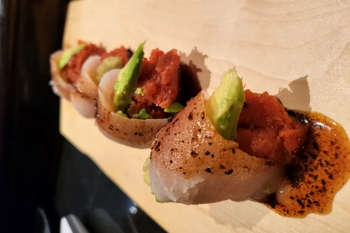 Albacore Lover, spicy tuna and avocado wrapped in albacore and served without rice