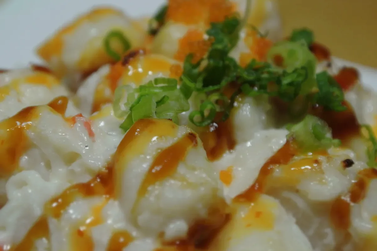 Baked Scallop roll, baked scallop spread over a California roll