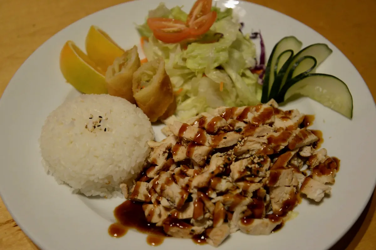 Chicken Teriyaki Plate with sliced glazed chicken, steamed rice and salad