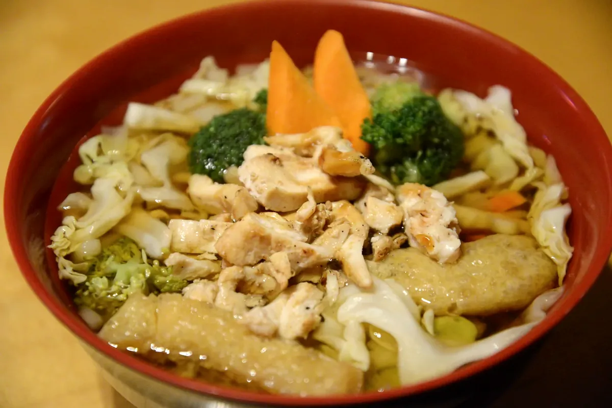 Chicken Udon with grilled chicken, cabbage, broccoli and carrot in broth