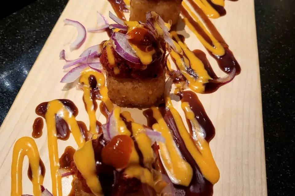 Crispy Rice on Spicy Tuna, four pieces of fried rice topped with spicy tuna