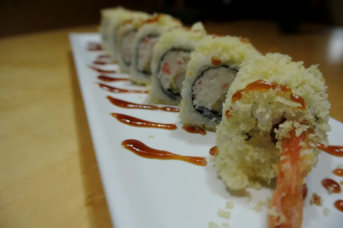Crunch roll made with shrimp tempura and crab, finished with crunch on top