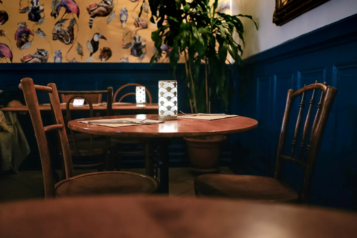 A single restaurant table set under low evening light