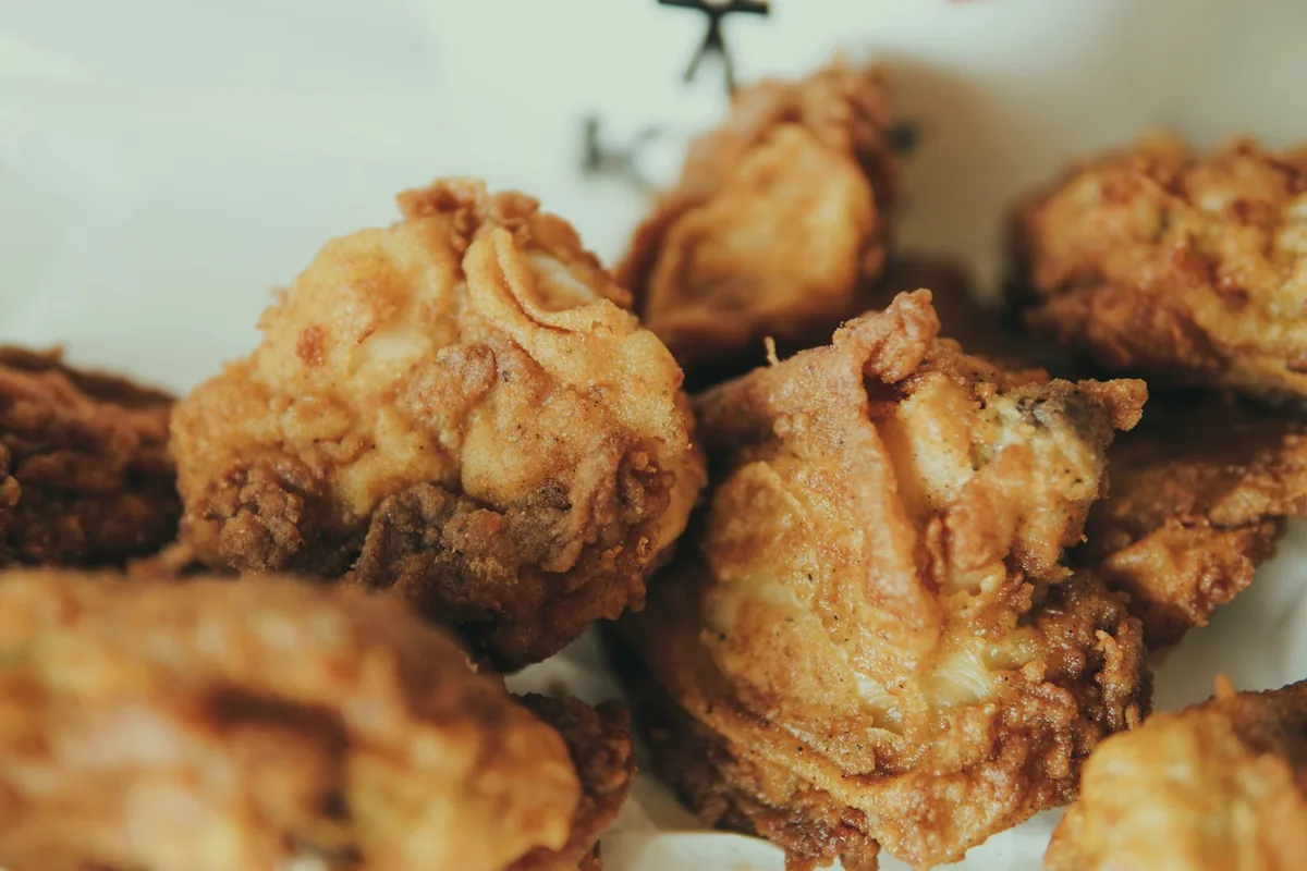 A heap of golden fried chicken pieces