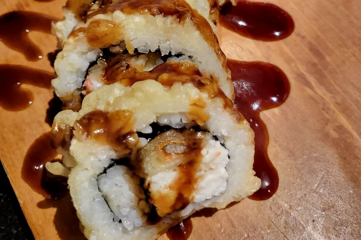 Jumbo Spider, a lightly fried spider roll, drizzled with dark sauce