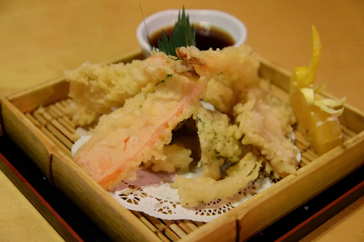 Mixed Tempura of shrimp and vegetables served in a bamboo steamer basket