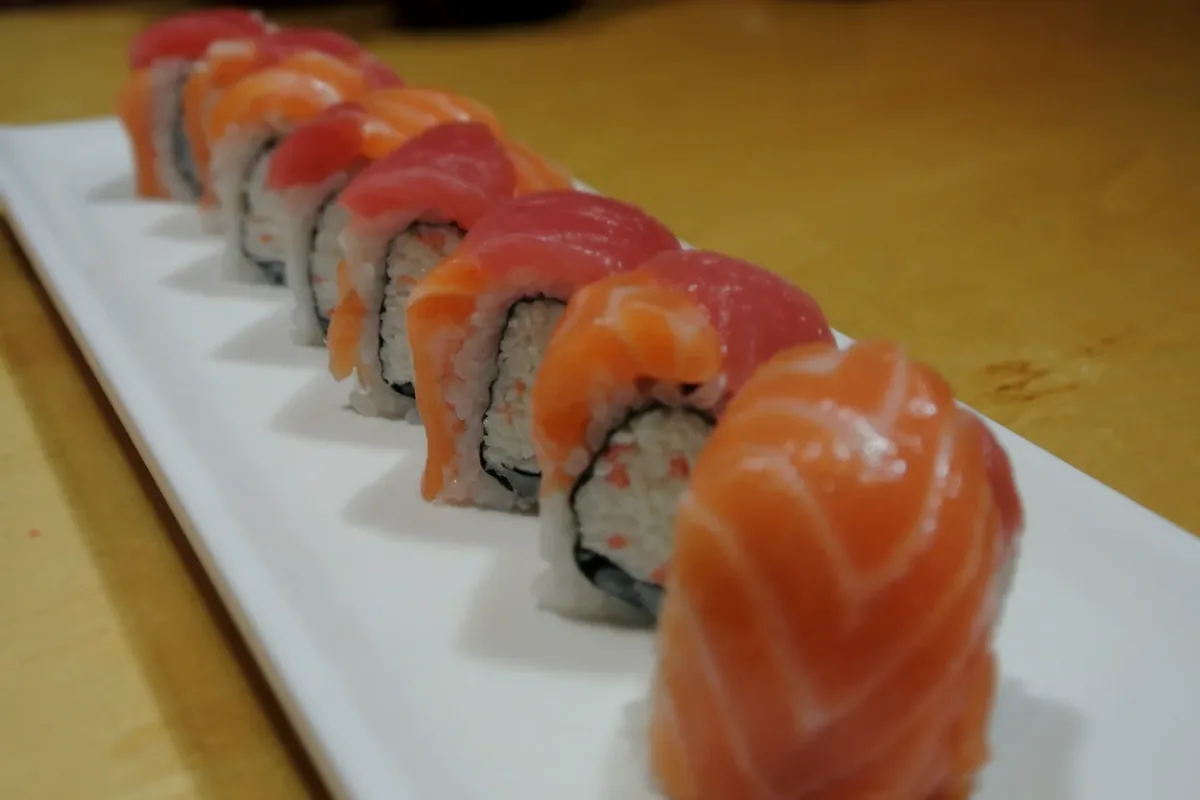 Ninja roll, tuna and salmon laid over a California roll