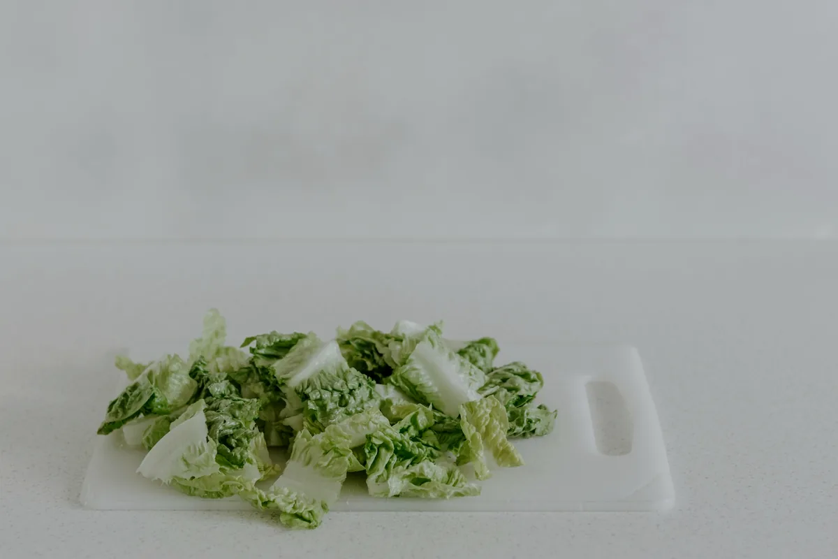 A small heap of green paste on a white cutting board