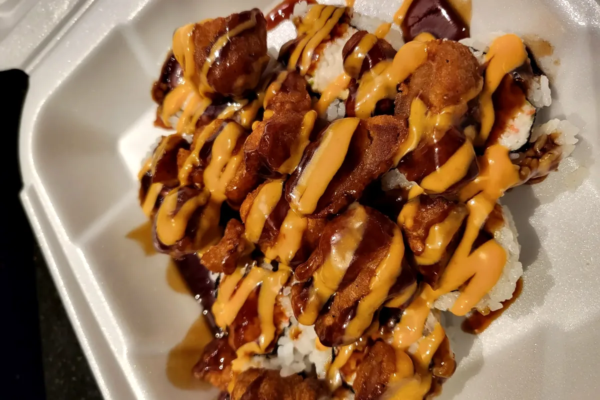 Popcorn Chicken roll, fried chicken piled onto a California roll