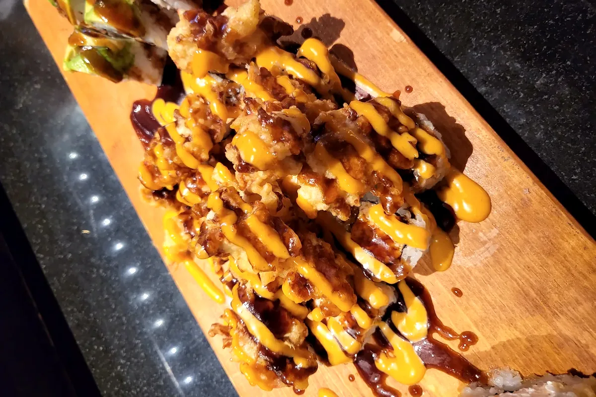 Popcorn Roll, deep fried crawfish over a spicy tuna roll