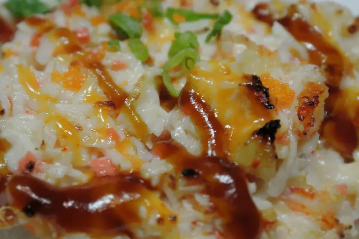 Rock 'N Roll with baked crawfish and imitation crab over a California roll
