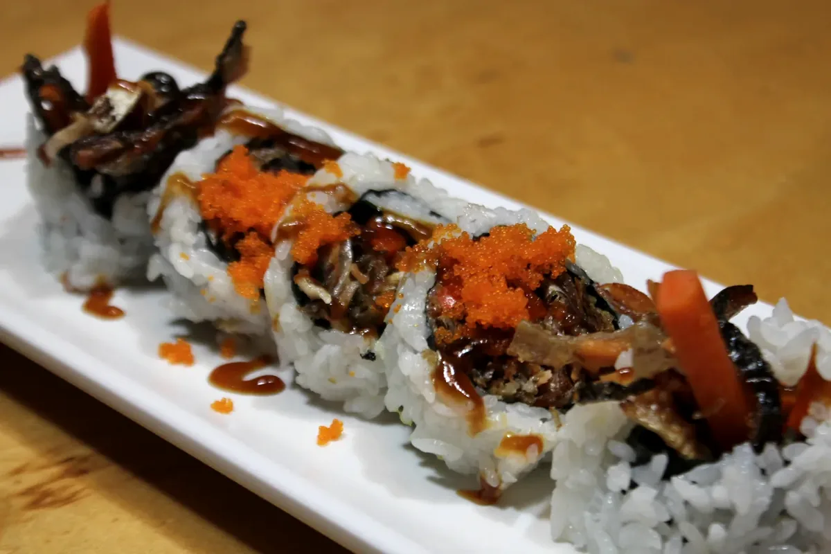 Salmon Skin Roll cut into pieces and topped with roe