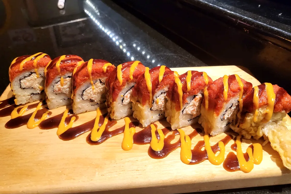 71 Freeway roll of shrimp tempura and crab, topped with spicy tuna