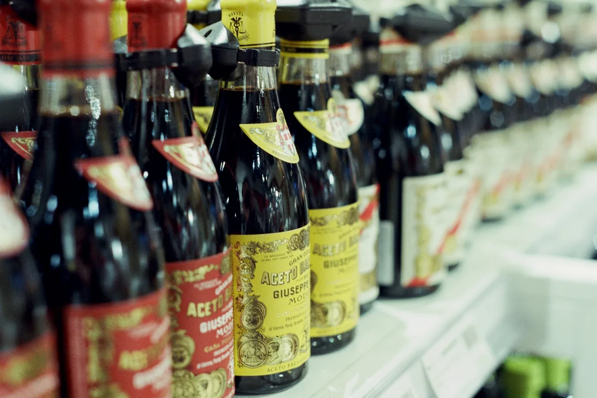 A shelf of soy sauce bottles in a shop