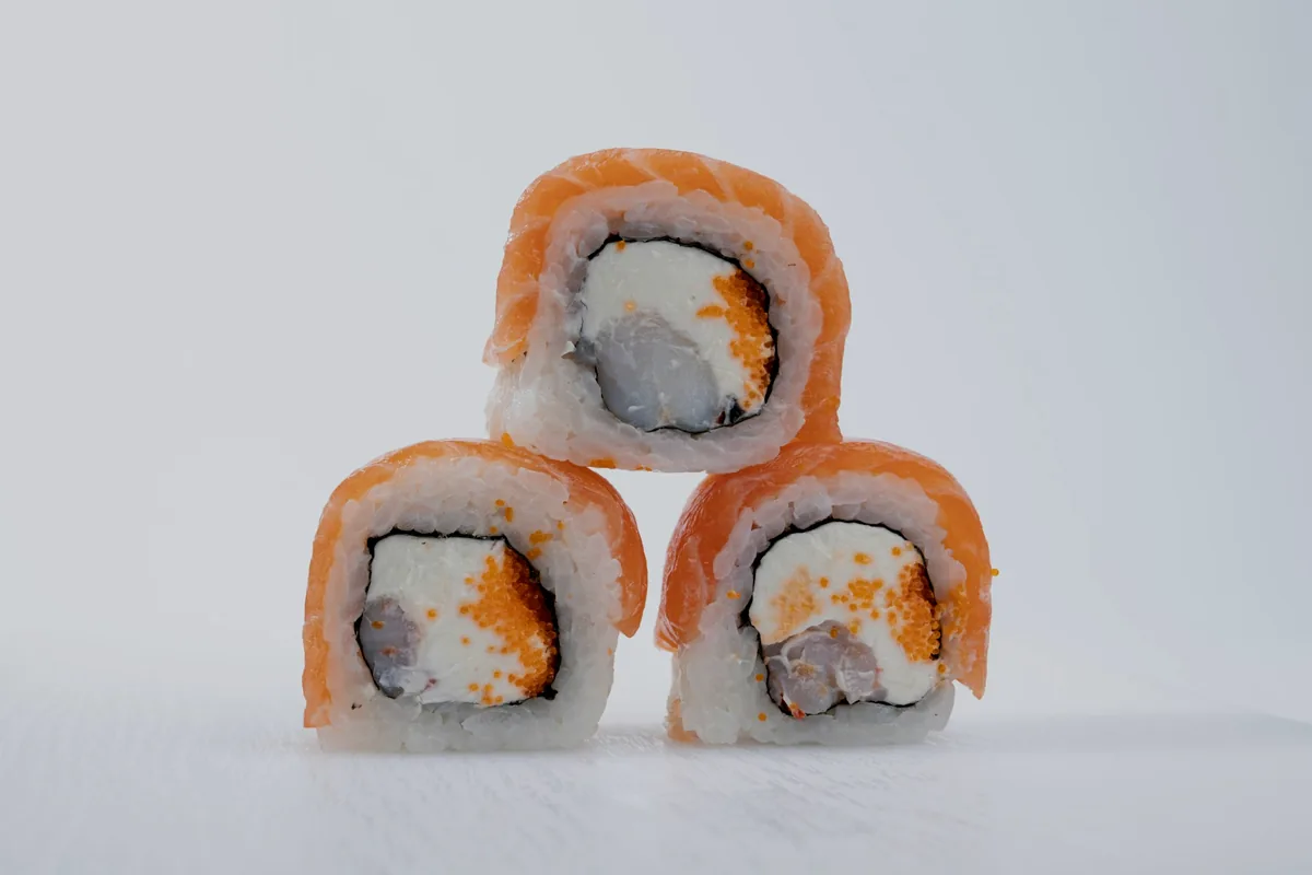 Three cut roll pieces stacked against a white background