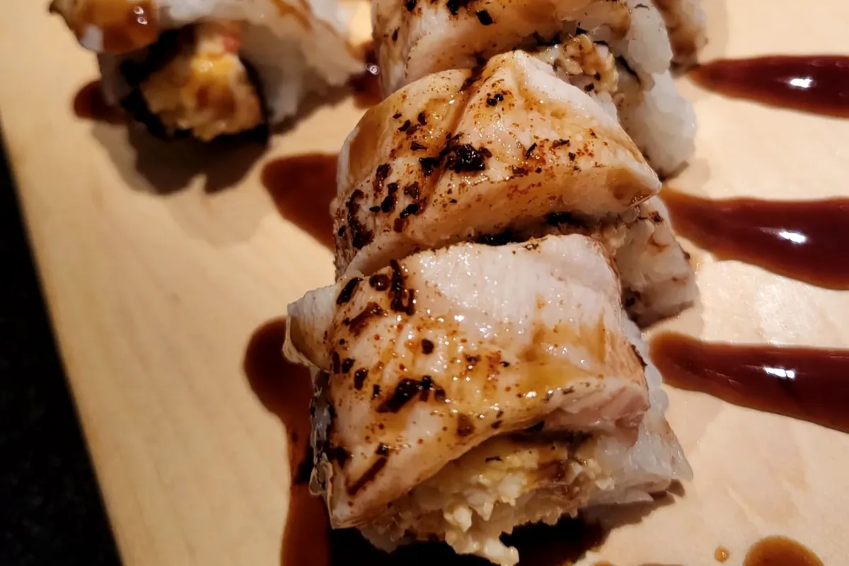 Tokyo 3, spicy crabmeat topped with Cajun salmon and finished with sauce