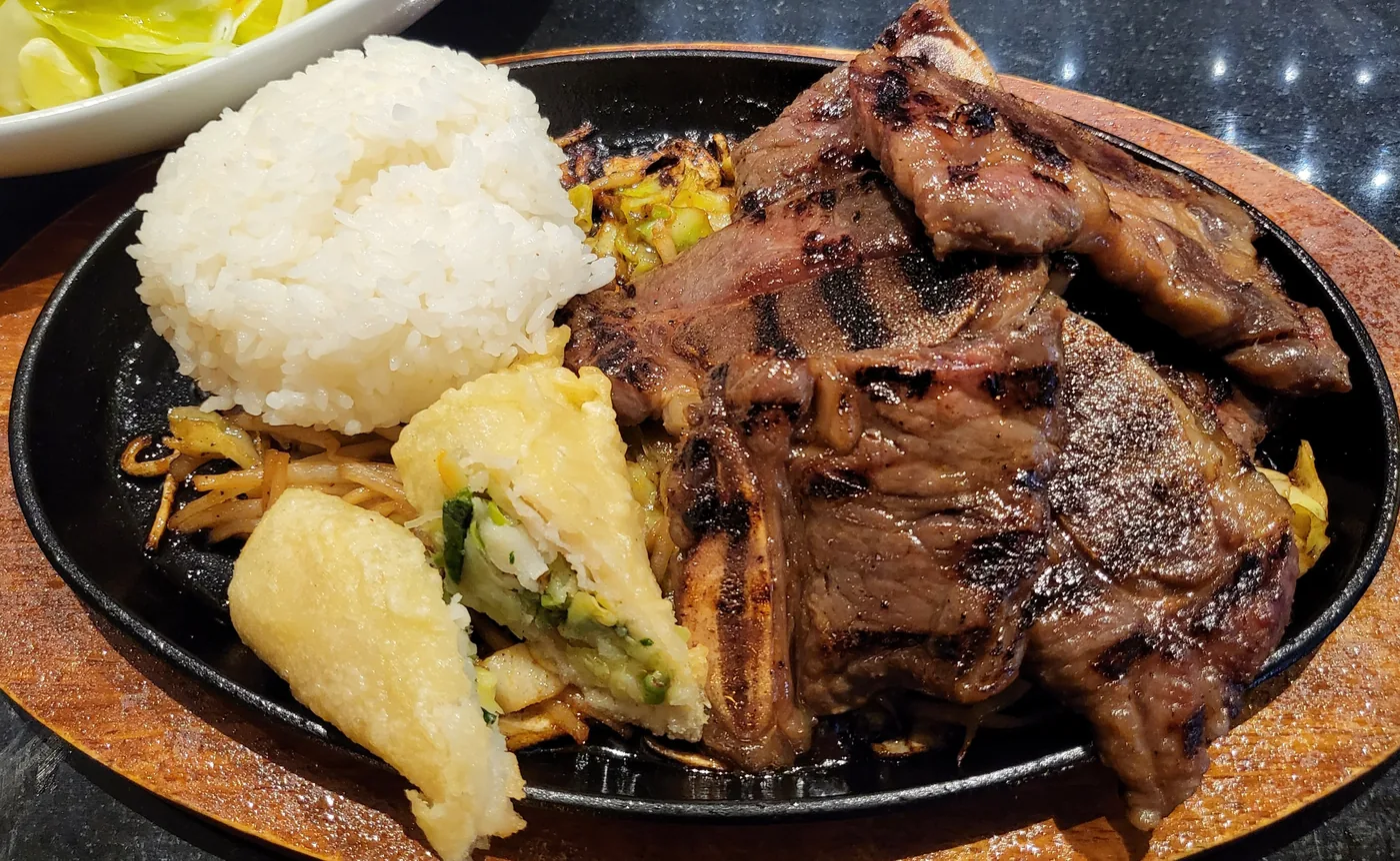 BBQ Short Ribs on a hot plate with steamed rice