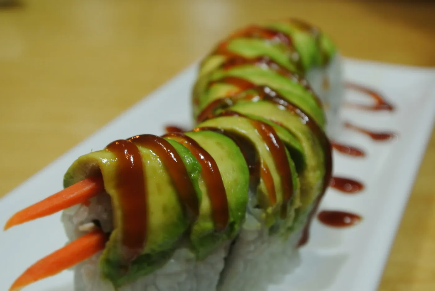 Caterpillar roll laid with avocado along its length