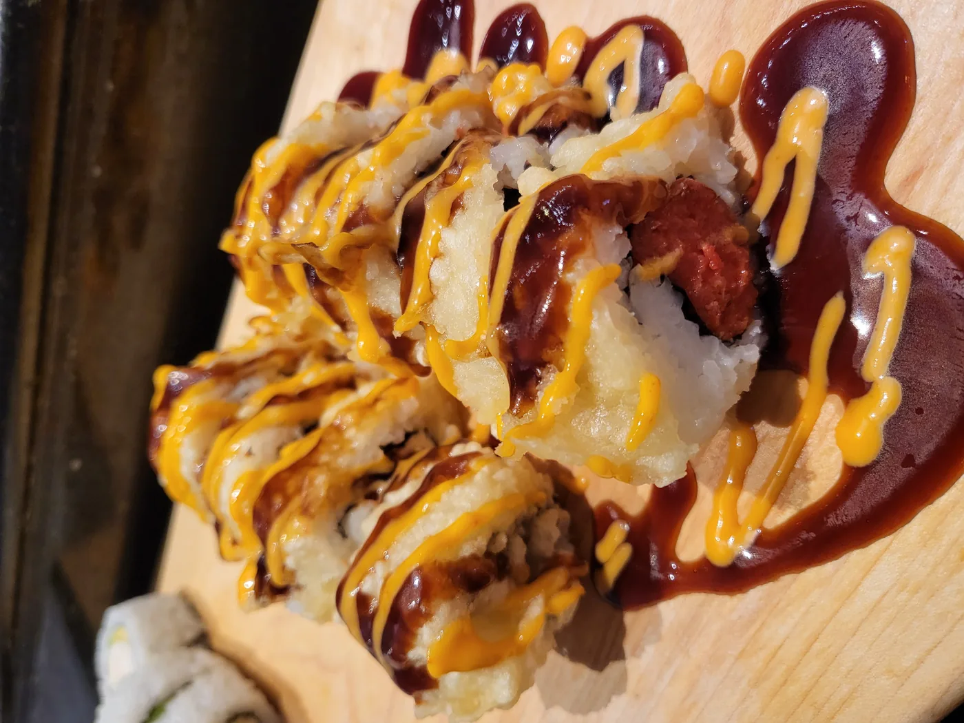 Crazy Girl - a lightly fried roll of spicy tuna and cream cheese with two sauces