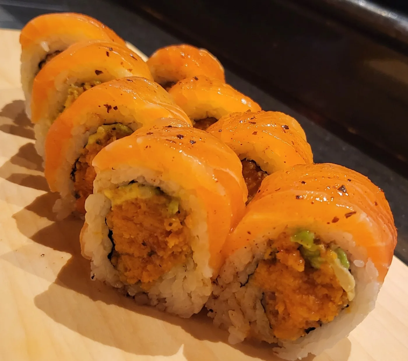 Double Salmon roll with fresh salmon laid over the top