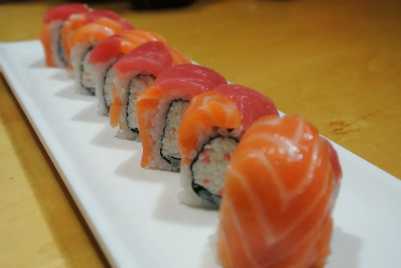 Ninja roll - tuna and salmon over a California roll