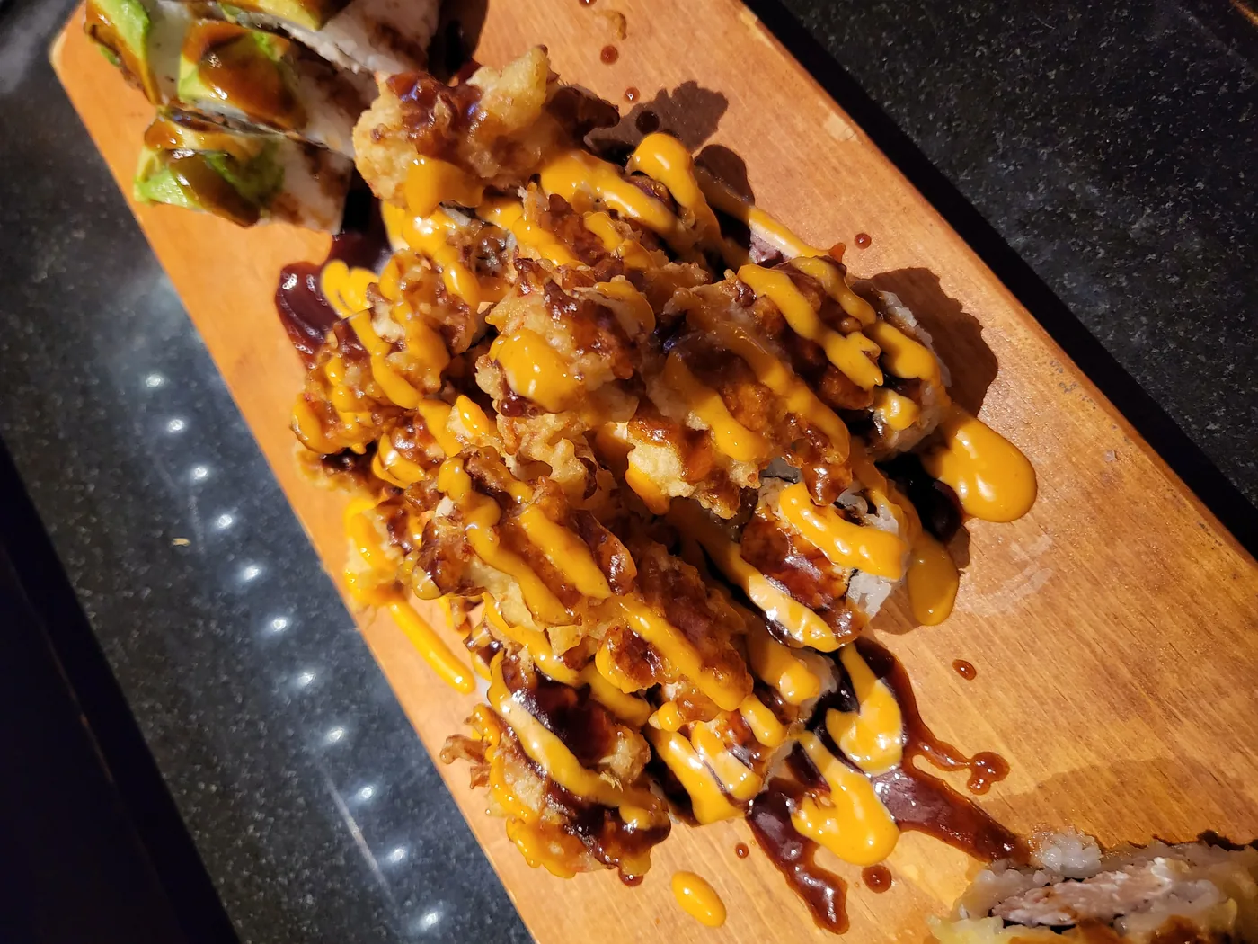 Popcorn Roll - deep fried crawfish piled over a spicy tuna roll
