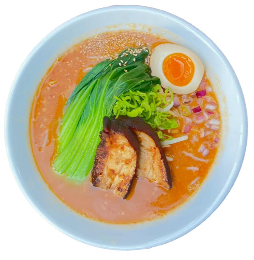 Spicy Miso ramen with braised pork belly, bok choy, soft egg and red onion