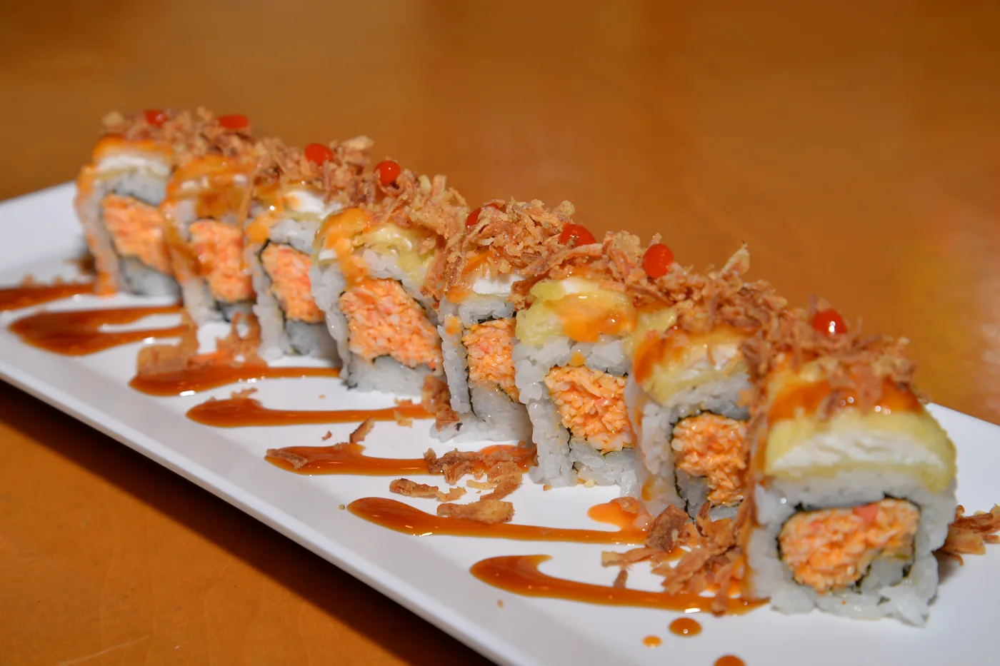 Tokyo roll - tilapia tempura and crispy onion over a spicy crab roll