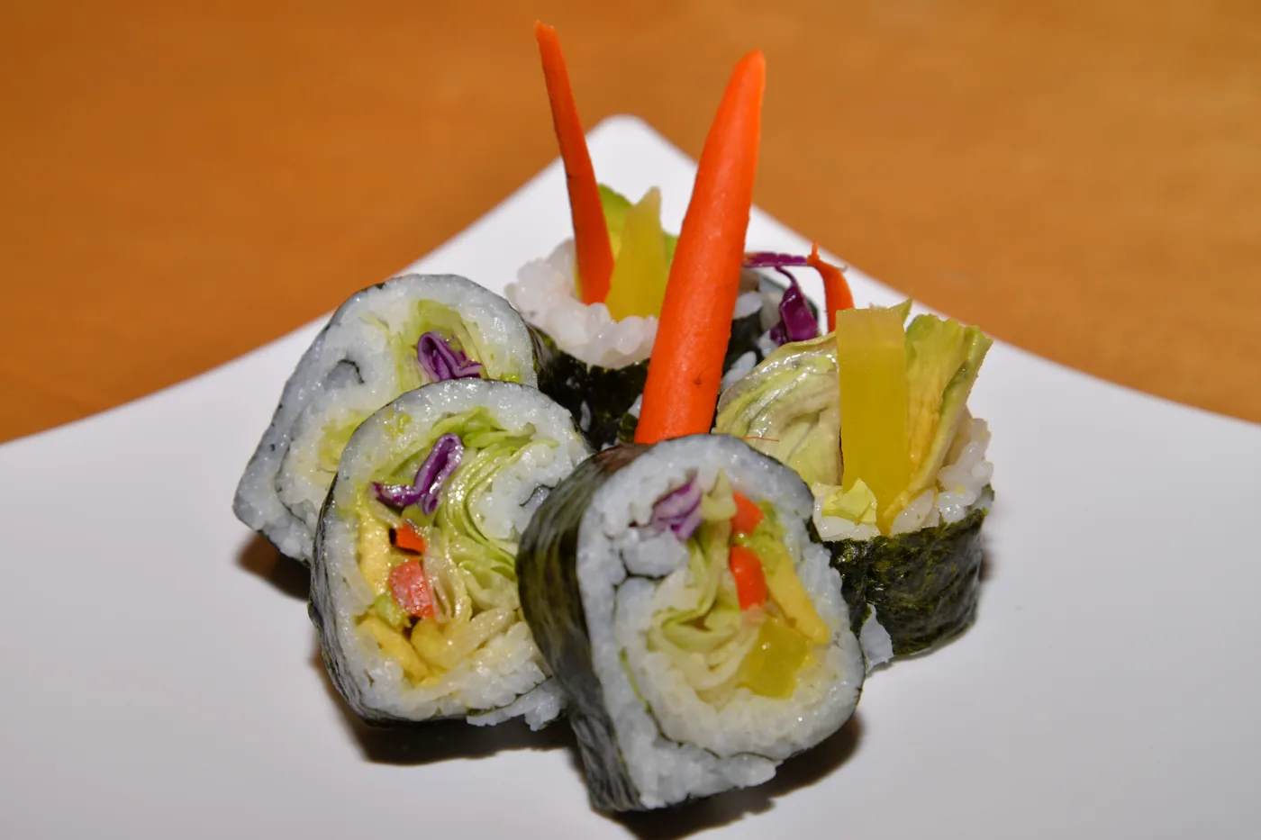Vegetable Roll cut into pieces with carrot and pickled vegetables inside