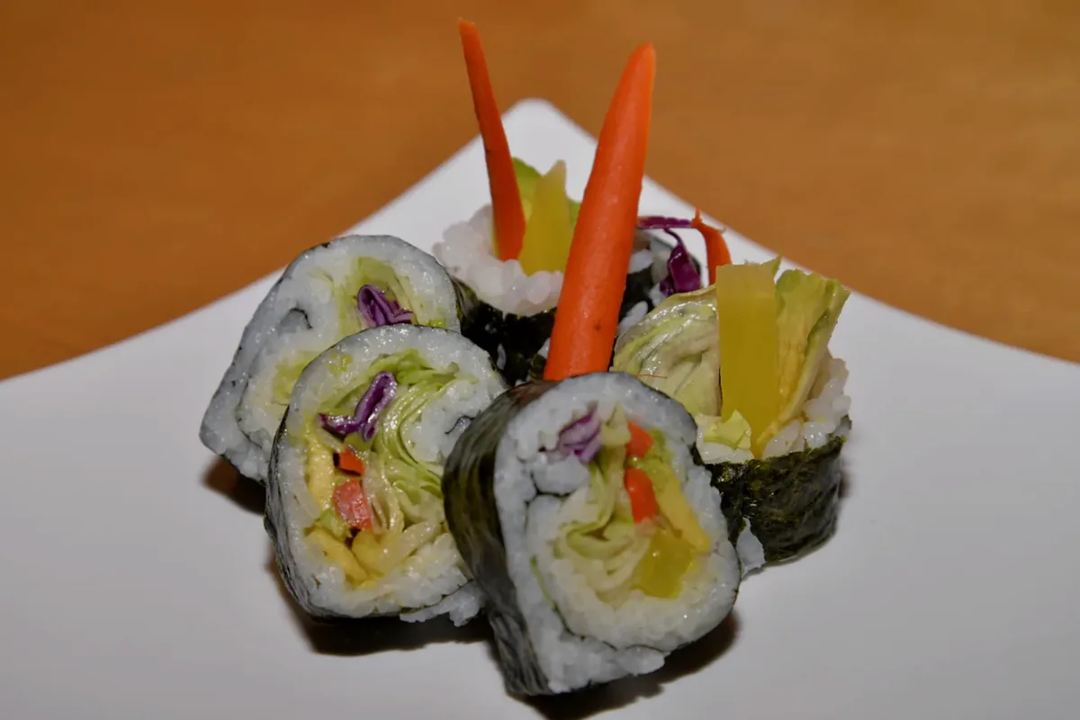 Vegetable Roll cut into pieces showing avocado and vegetables inside