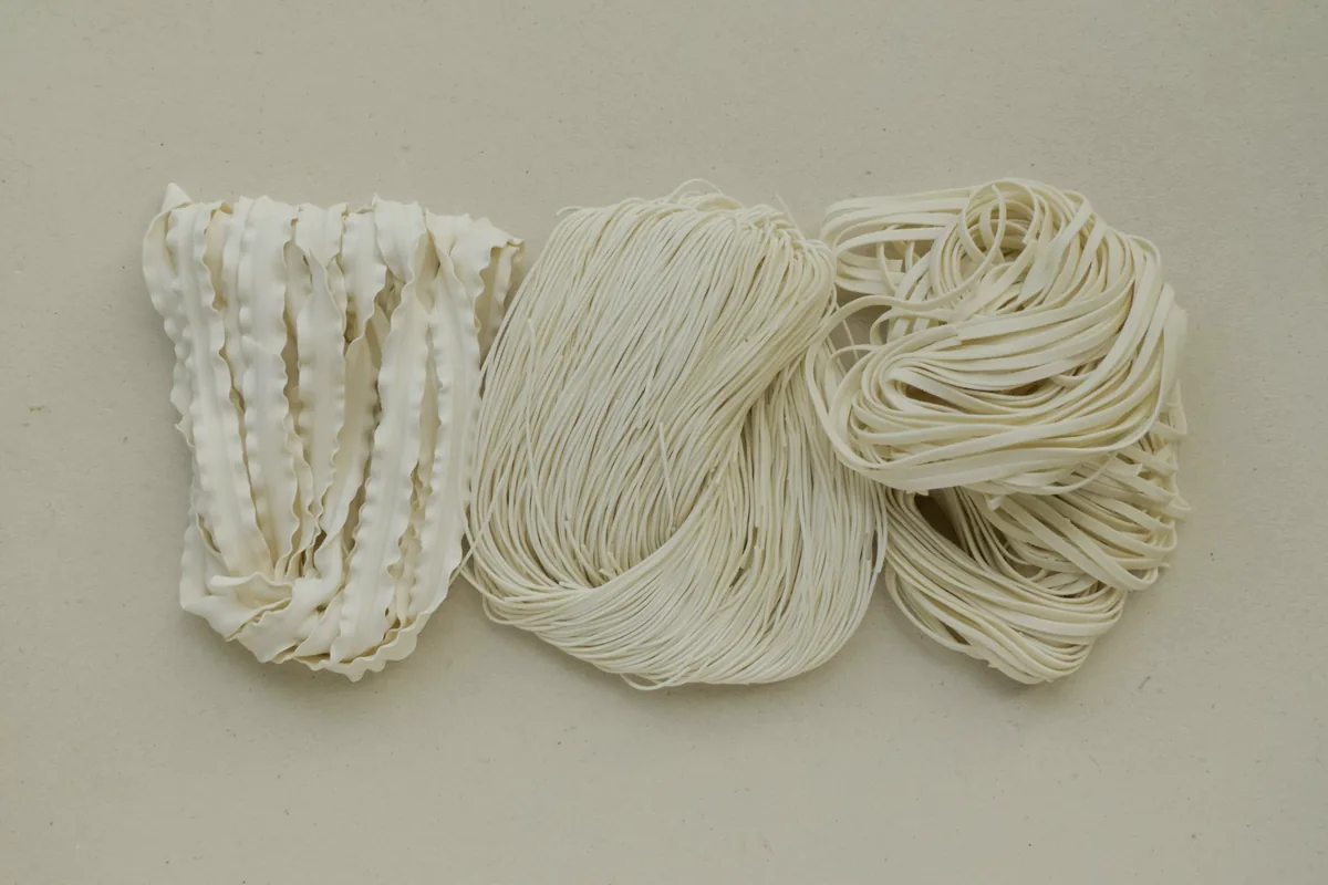 Bundles of dried wheat noodles of three different thicknesses